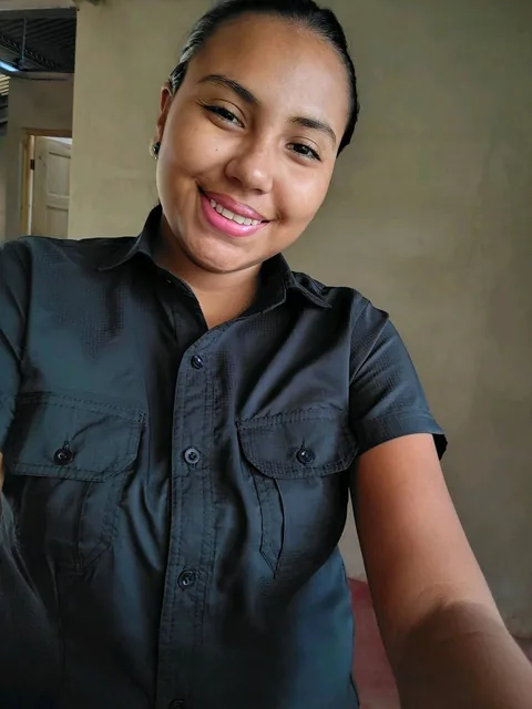 Fran in a dark shirt, taking a selfie